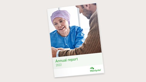 Cover of Mölnlycke integrated Annual & Sustainability Report 2021 with a child patient and a nurse