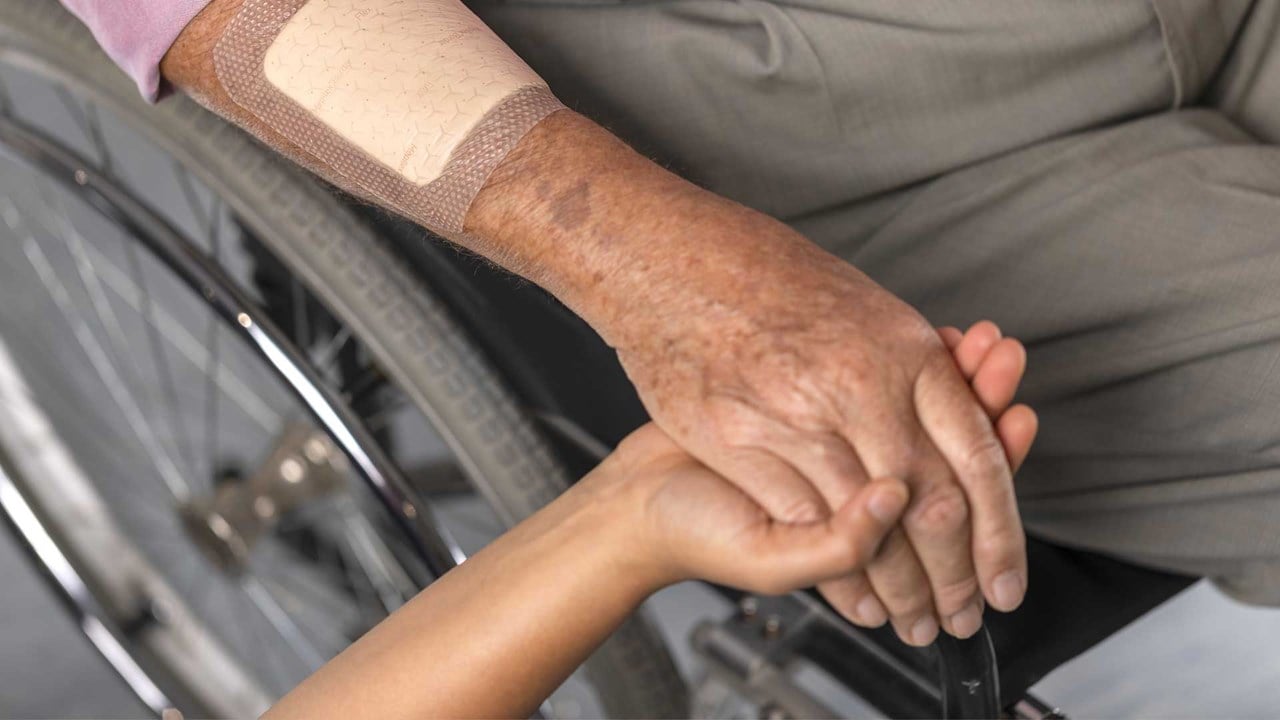 Male nurse caring for an elderly patient