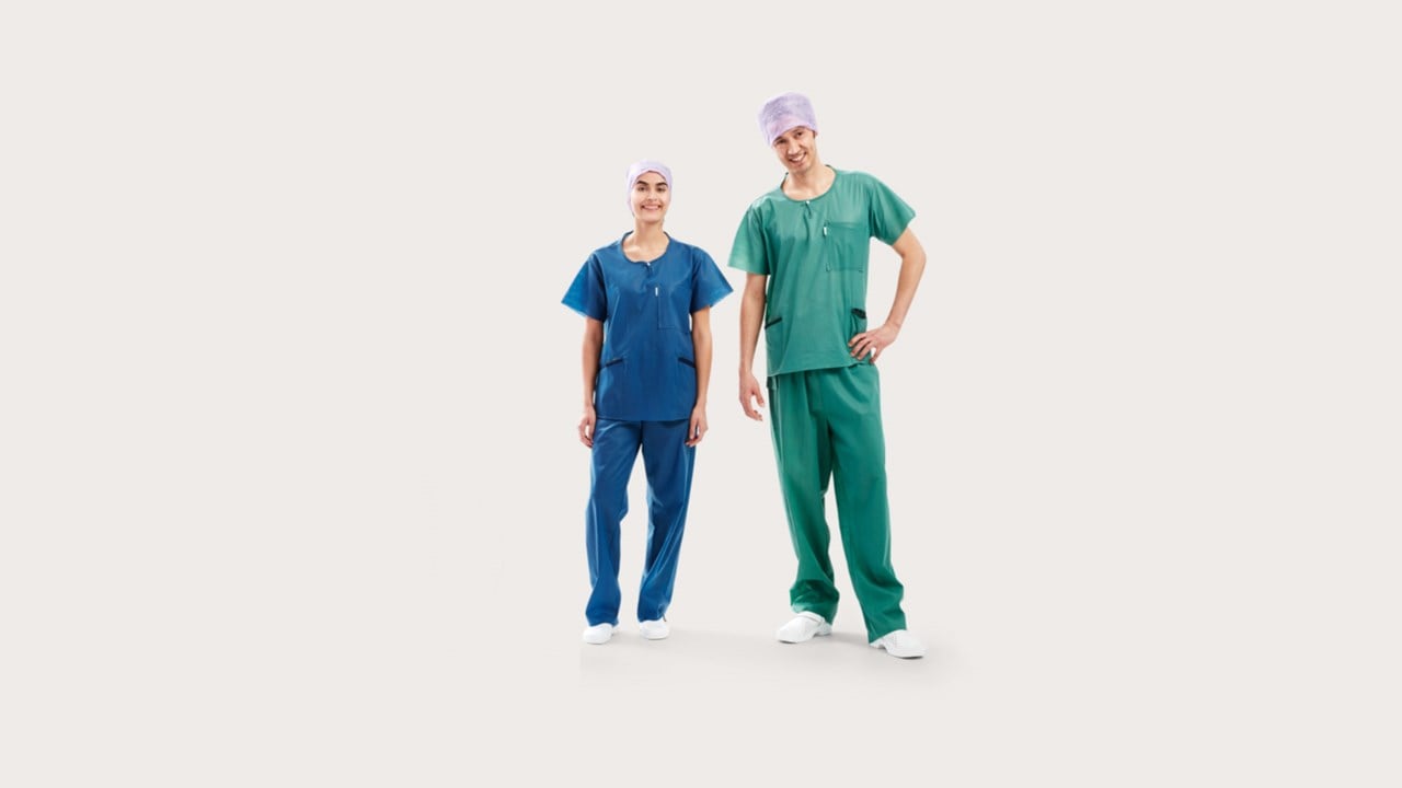 Three clinicians wearing BARRIER® Scrub Suit – extra comfort